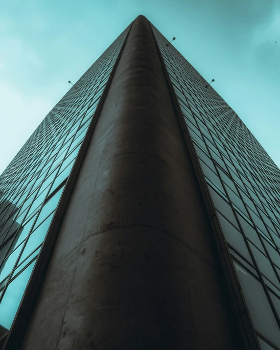 a tall building that is covered in a blue sky