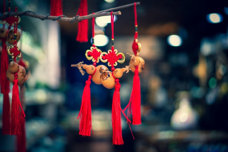 a close up of a group of beads hanging from a string