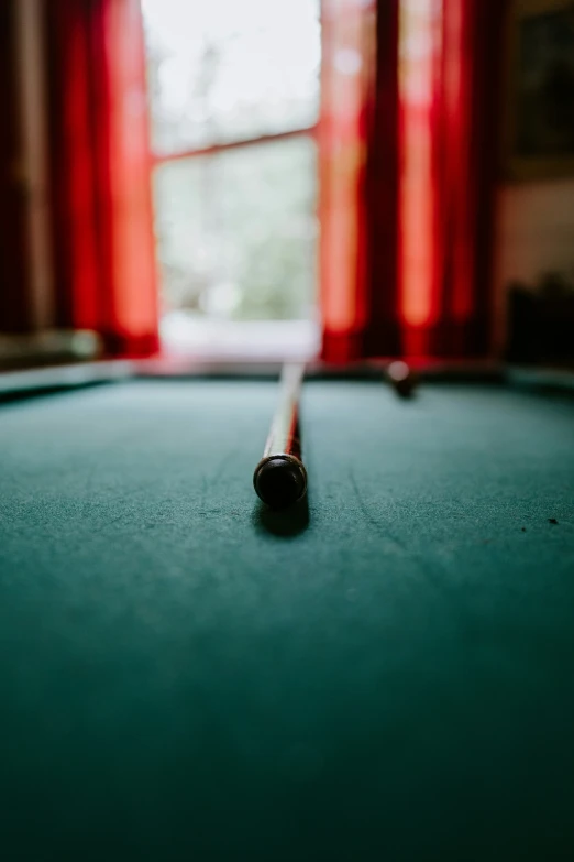 pool table with dark surface and green cloth