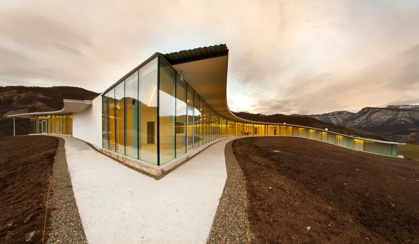 a very modern and modern looking building that is covered in glass