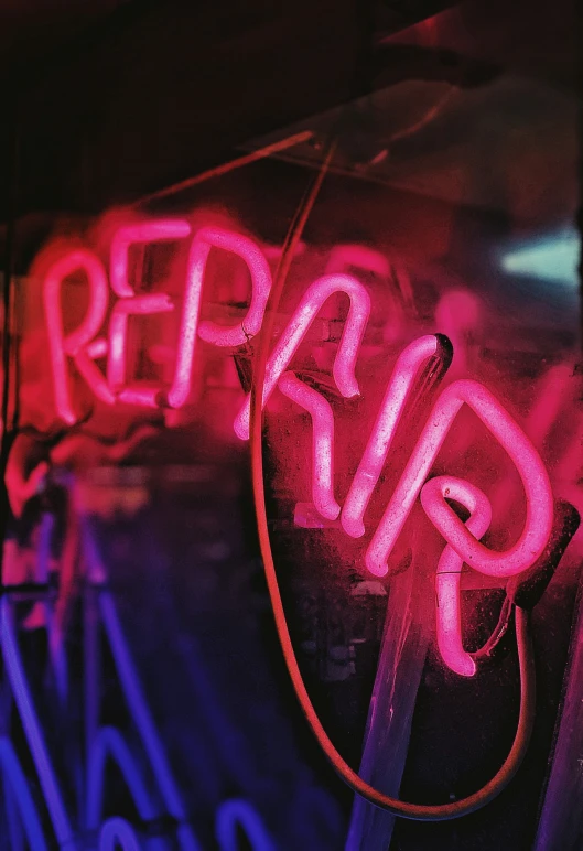 an image of a neon sign that is reading repair