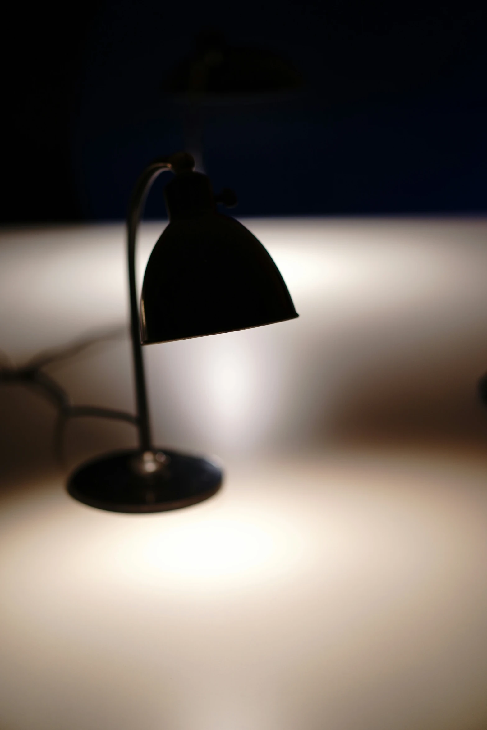the dim light of a table lamp shines brightly on the surface