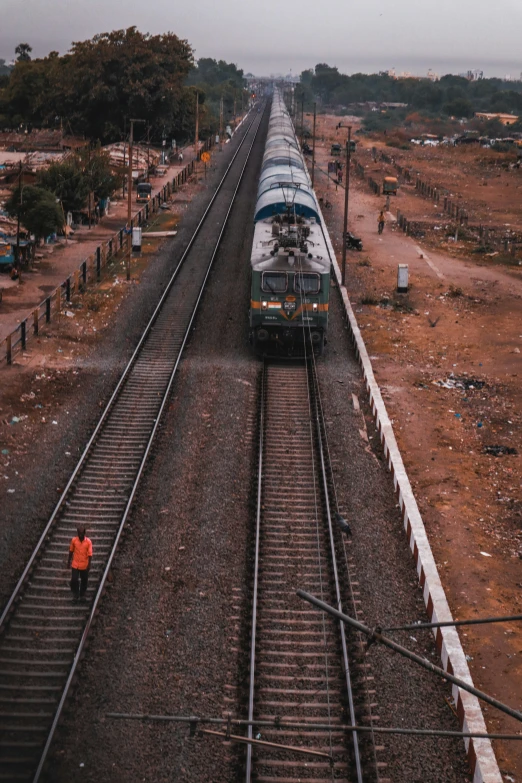 an aerial view of a train and train tracks