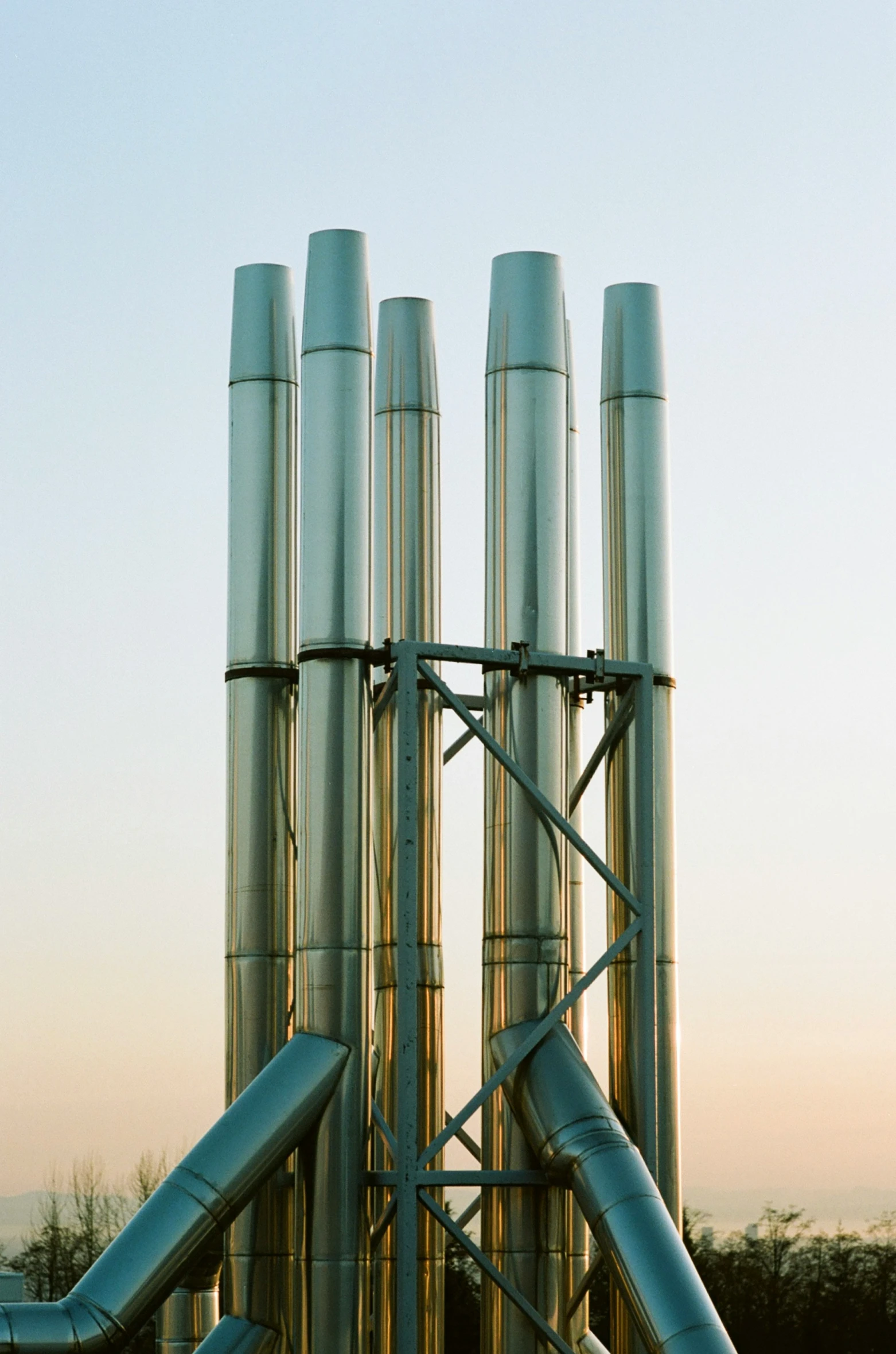 multiple stacks of pipes standing on each other