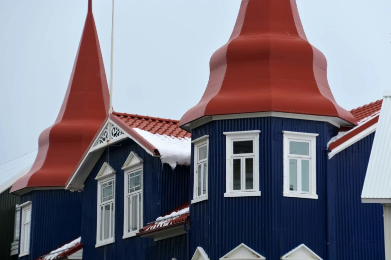 some very colorful buildings with turrets and windows