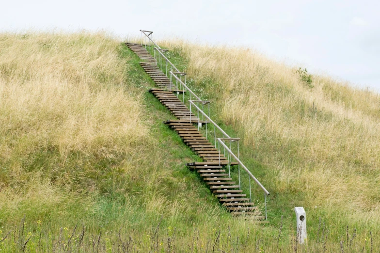 there is a flight of stairs leading up into the sky