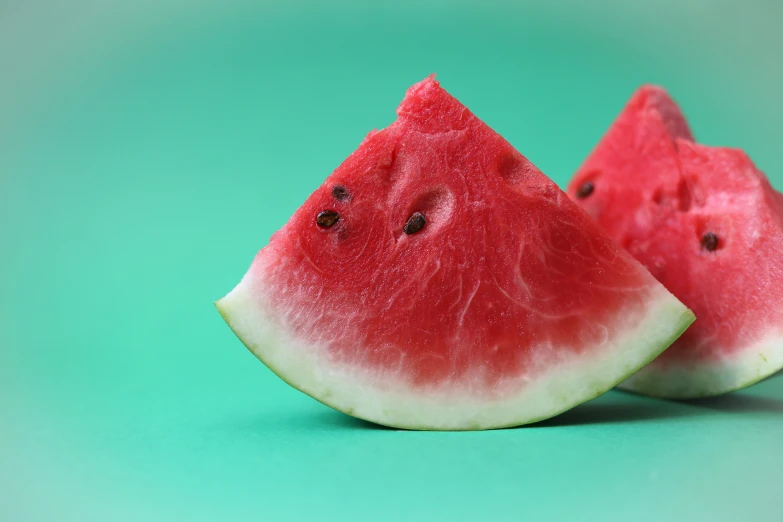 two slices of watermelon placed close together
