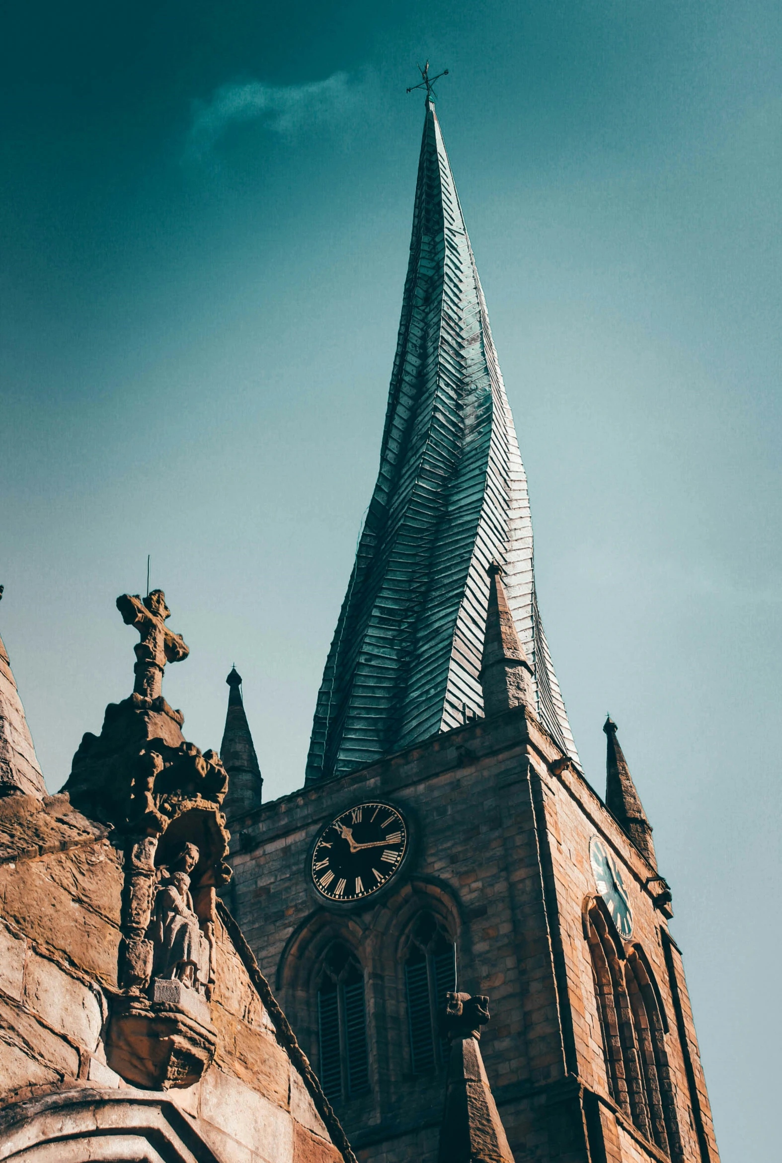 an old church has steeples that are made of wood