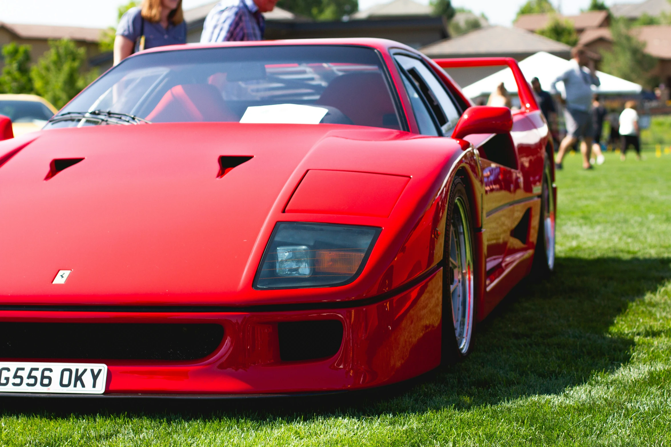 a close up s of a red sports car