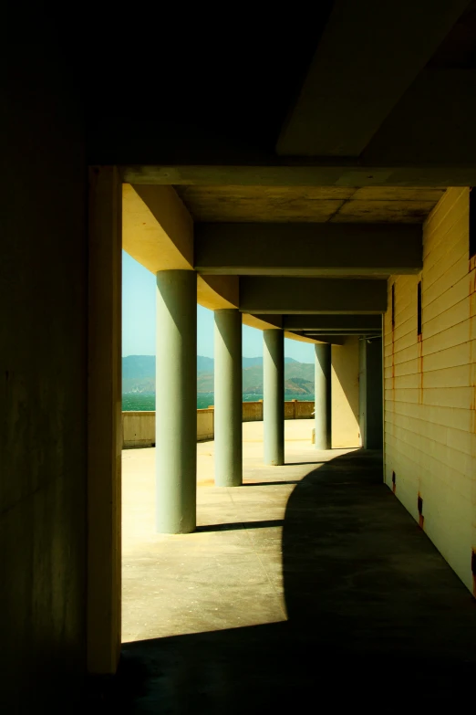 an empty walkway and the end of an outside structure