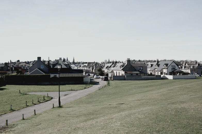 houses are shown on the hillside in this black and white po