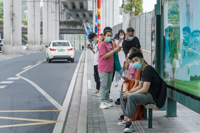 people line up for an online subway bus ride