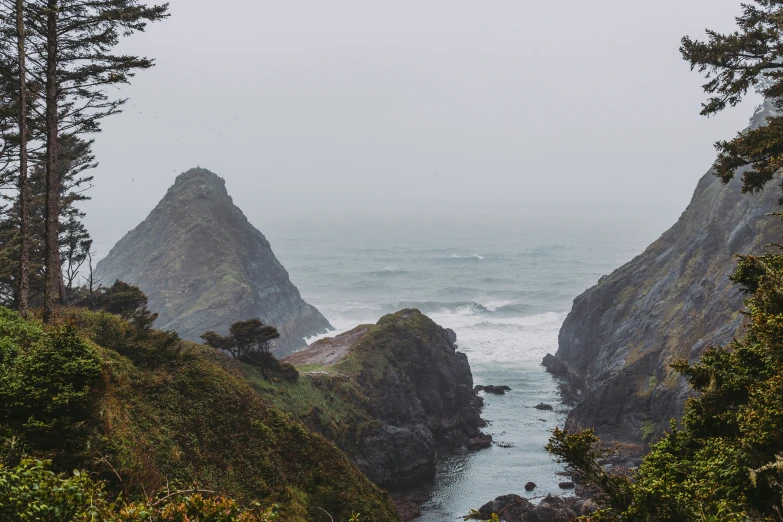 a sea cliff and the water is crashing in