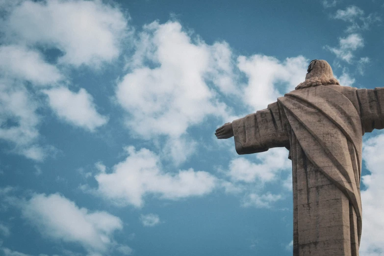 the statue is posed high and on display