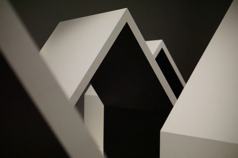 a group of structures made from paper in the dark