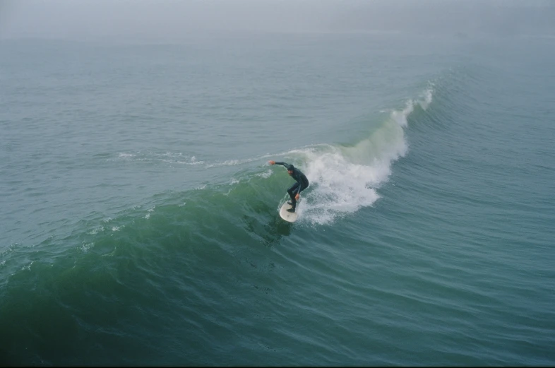 a surfer is on top of an ocean wave