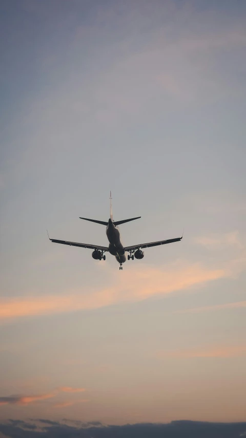 an airplane in the sky over the ocean