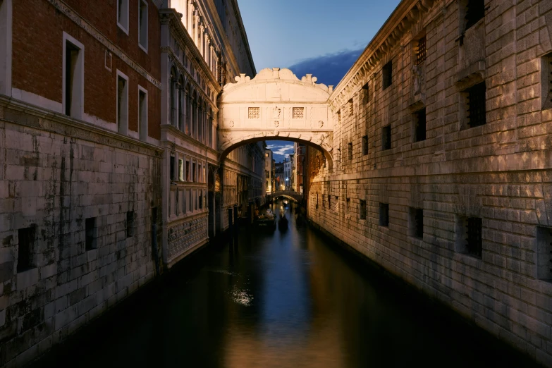 a narrow canal between some buildings and water