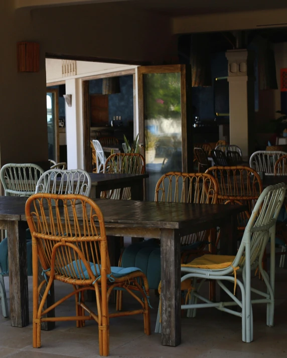 a large brown wooden table with some chairs around it