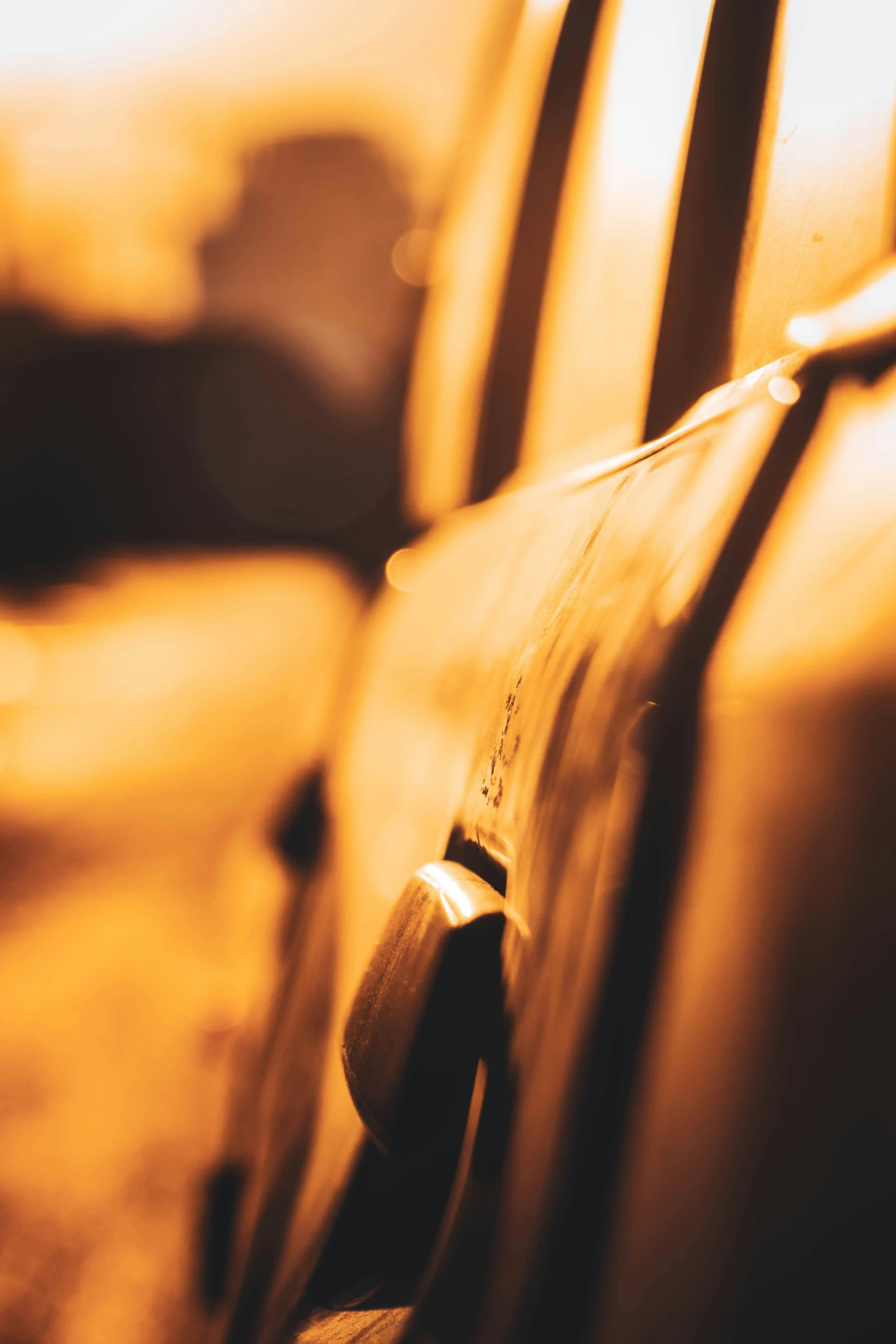 the back of a car is seen at sunset