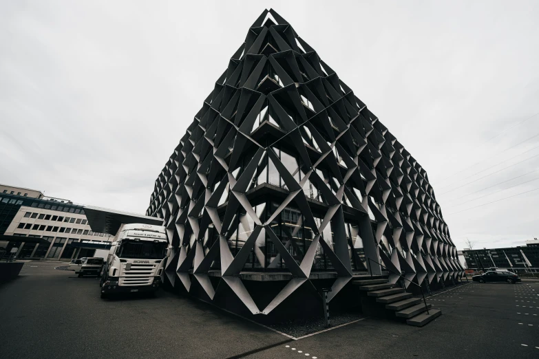 the giant building is in the middle of a parking lot