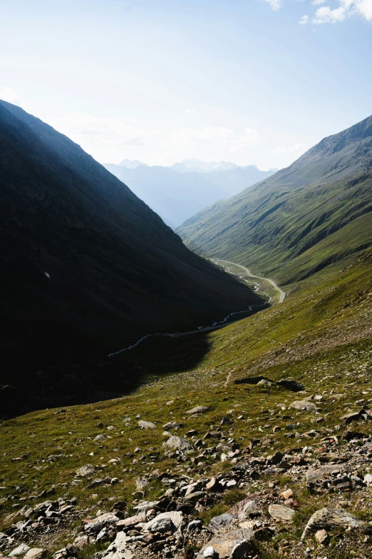 a couple of hills with grassy areas on one side