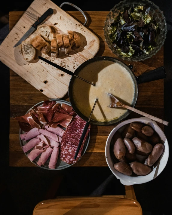 several plates and bowls of food on a table