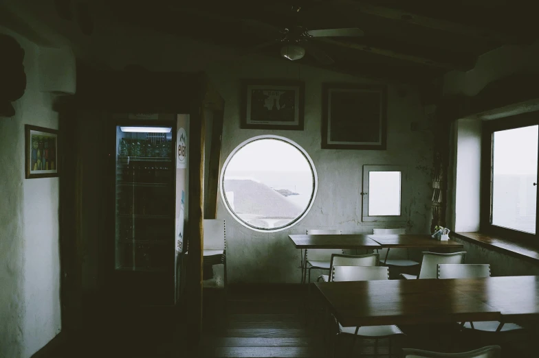 an arched dining area in a home, viewed through an opening