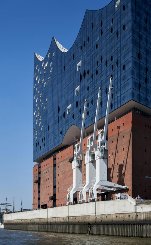 several cranes are sitting on the side of a boat