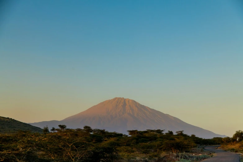 a view of a mountain top as the sun rises