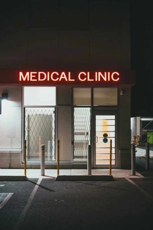 a medical clinic is lit up in red