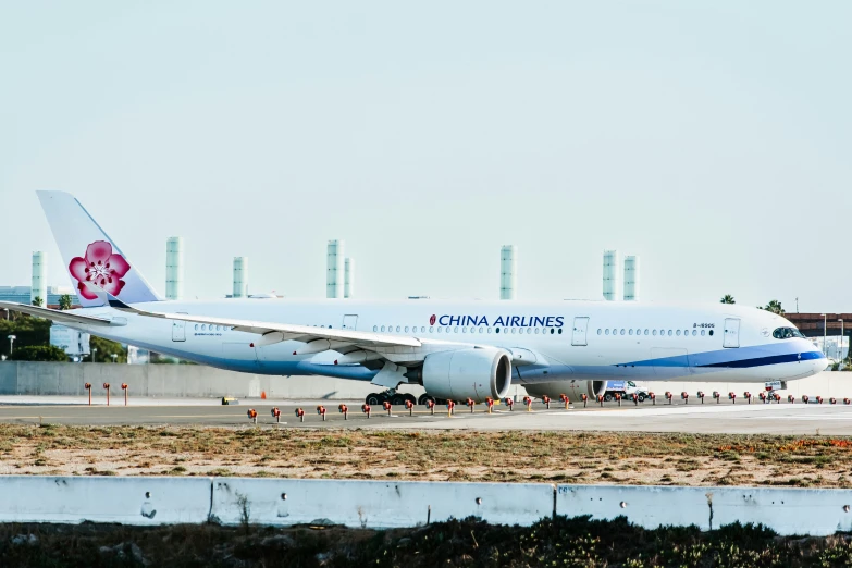 a large passenger jet sitting on top of an airport runway