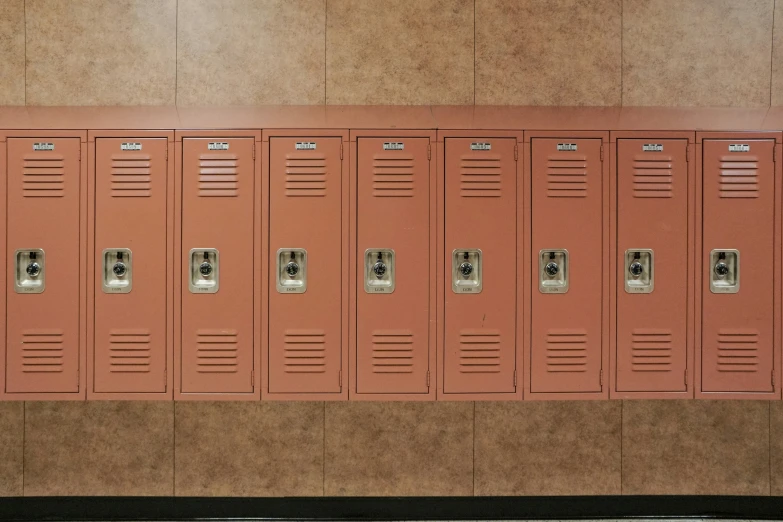 a wall with several lockers against the walls