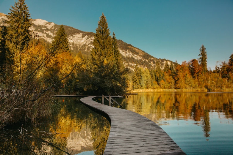 a wooden dock in the middle of a lake