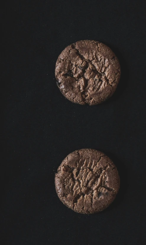 two cookie cookies, each chocolate - filled with nuts