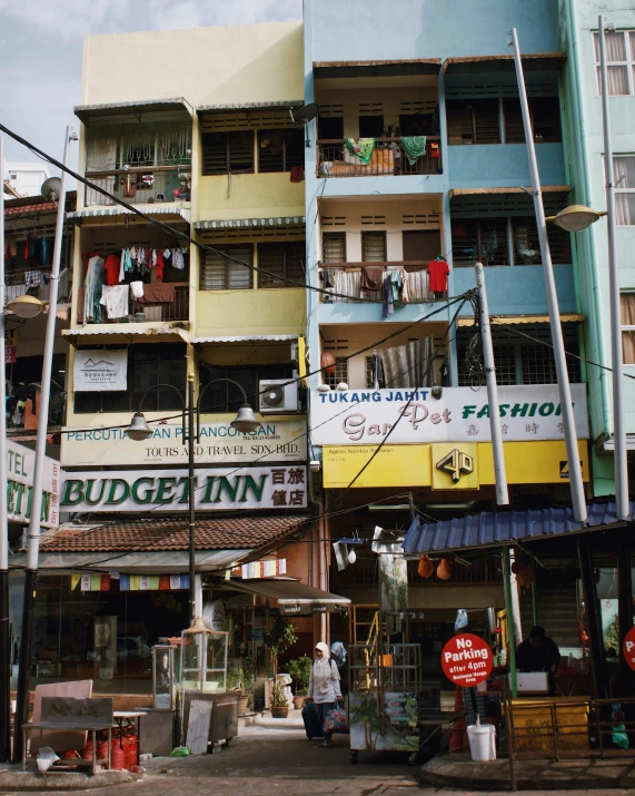 a colorful building and two people standing outside