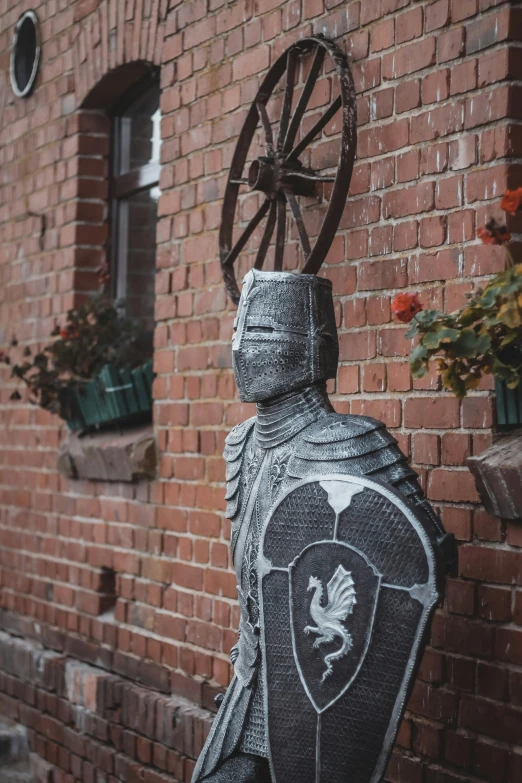 there is a black and white design on the brick wall