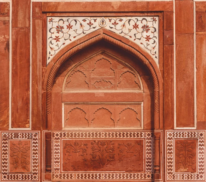 closeup of ornate red and white architecture on top of a building