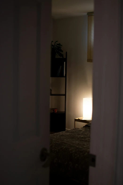 the light shines brightly in this dimly - lit bedroom