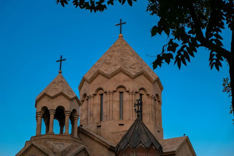 there is an old gothic building with a clock on the top