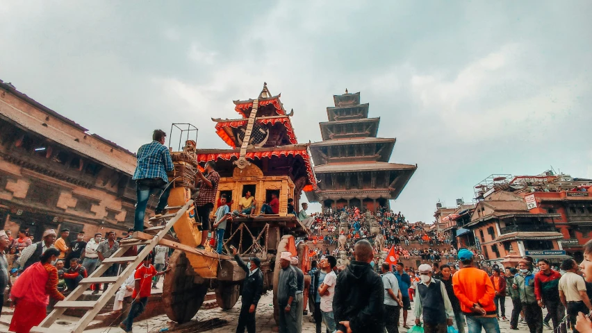 a group of people gathered outside in an indian town