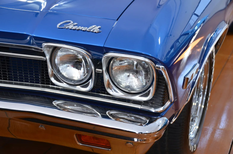 a blue car is shown with chrome trims