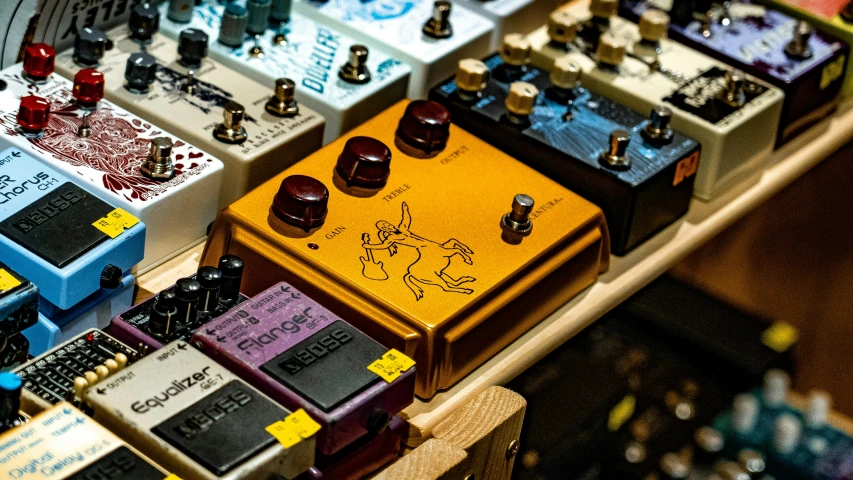 many electronic guitars, one with a blue and one without, are on display