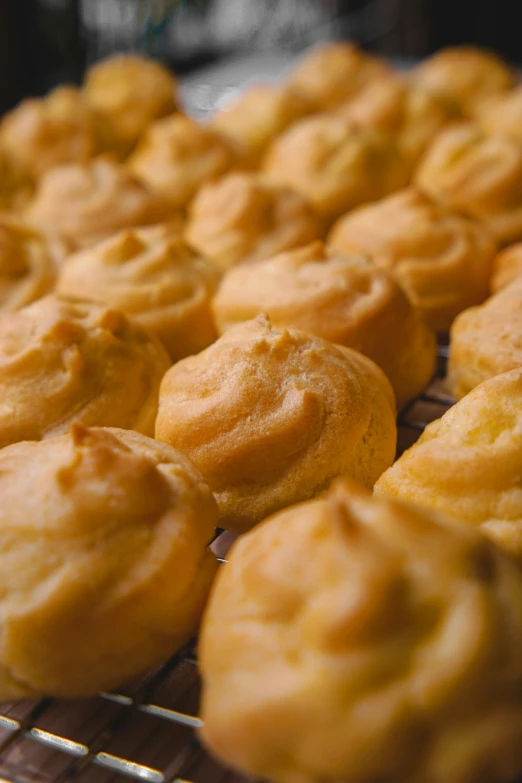 a close up of many dessert items on a rack