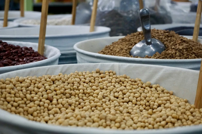 a bowl full of brown grains on top of white bowls