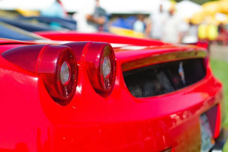 a close up of the bumper of a red sports car