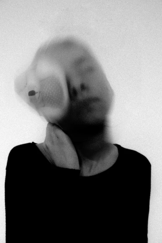 a woman with a white object blowing around her head