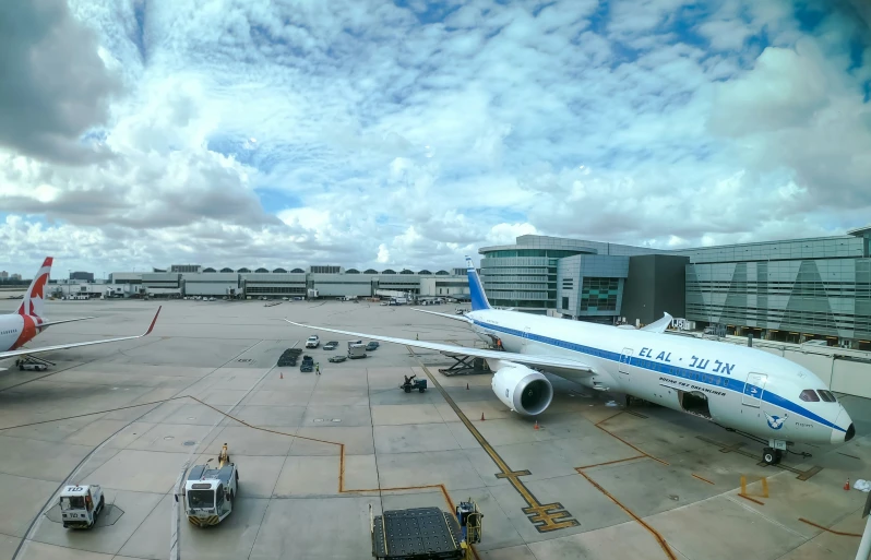 several planes on the runway outside of an airport