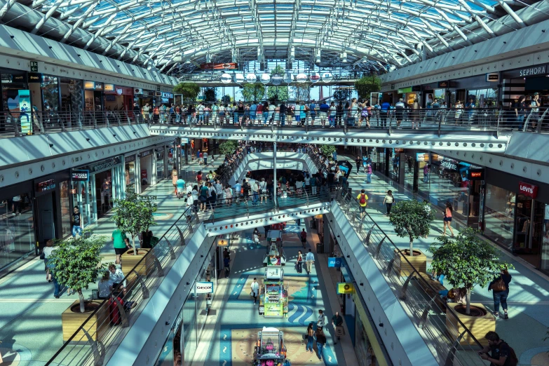 a view of an indoor shopping mall with many shops