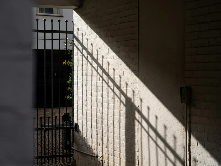 a building with bars and a fenced off area